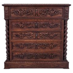 an ornate wooden dresser with drawers and carvings on the front, in dark brown wood