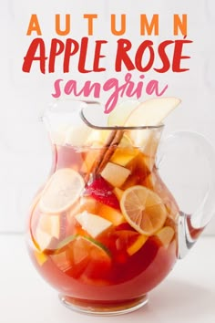 an apple rose sangria in a glass pitcher