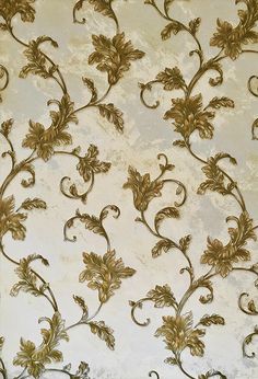 the wallpaper is decorated with gold flowers and vines on white paper, which has been hand - sewned