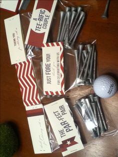 golf balls and tees wrapped in plastic bags on a wooden table with other items