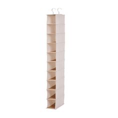 a tall white hanging organizer with six shelves