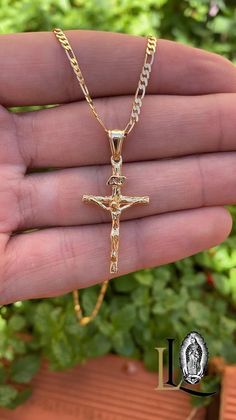 Embrace timeless style and faith with our Rustic Cross Necklace, featuring a uniquely crafted cross with a diamond cut design that adds a touch of brilliance to its rugged charm. Paired with a classic Figaro chain, this necklace is both versatile and elegant, making it a perfect accessory for both men and women. PRODUCT DETAILS * Material: 14K Gold Filled * Metal Purity: 14K * Chain Size: 20" and 24" Inches * Chain Thickness: 2.3mm * Pendant Size: 33x18mm * Chain Style: Figaro Link * Gender: Uni Crucifix Cross Necklace With Figaro Chain As Gift, Adjustable Crucifix Chain Jewelry, Rustic Cross, Mens Cross Necklace, Newark Nj, Mens Crosses, Gold Cross Pendant, Necklace Diamond, Figaro Chain