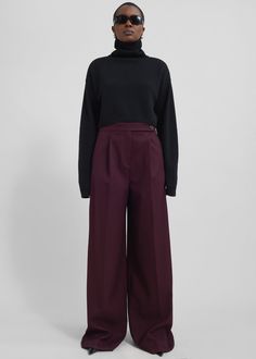 Color: Burgundy Midweight woven fabric Regular fit Wide leg Mid-rise Belt loops Side seam pockets Back illusion welt pockets Zip fly Asymmetric front button closure Unlined 77% Polyester 21% Rayon 2% Elastane Dry Clean By The Frankie Shop. Imported Wine Red Pants Outfit, Burgundy Trousers Outfit, Italian Street Style Women, Burgundy Pants Outfit, Sweater With Dress, Maroon Pants Outfit, Red Pants Outfit, Burgundy Trousers, Italian Fashion Street