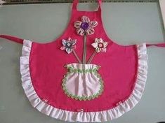 a pink apron with flowers on it