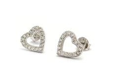 Product Description: These Sterling Silver Heart Stud Earrings with Cubic Zirconia are a sparkling addition to any jewelry collection. Delicately handcrafted from high-quality recycled silver, these earrings feature a minimalist heart shape embellished with lustrous cubic zirconia gemstones. Measuring at 9 millimeters in length and 8 millimeters in width, these earrings are designed to sit comfortably on the earlobe. The push back closure ensures they stay securely in place. Highlights: - Handma White Gold Heart Cut Pierced Earrings, Sterling Silver Open Heart Jewelry With Vvs Clarity, Pierced Diamond Heart Cut Earrings, Heart-shaped White Gold Diamond Earrings For Pierced Ears, Diamond Heart Earrings With Vvs Clarity As Gift, White Gold Heart Diamond Earrings, Silver Diamond Earrings With Brilliant Cut For Valentine's Day, Diamond Heart Shaped Earrings For Gift, Diamond Open Heart Earrings For Anniversary