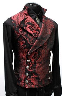 "An elegant double breasted vest for formal occasions. A fitted vest made in rich red and black tapestry fabric with a stand up top collar and wide sweeping lapels. Fastens on the inside with a sturdy button and buttons on the outside with five engraved metal buttons. The vest back and inside lining is made from rich black satin. Comes in sizes small-XXXL. Wonderful! Measurements: Small: Chest 39\" Stomach 36\" Waist 34\" Medium: Chest 42\" Stomach 38\" Waist 36\" Large: Chest 44\" Stomach 42\" Vampire Aristocrat, Gothic Fashion Men, Masquerade Outfit, Vest Clothes, Red Tapestry, Tapestry Vest, Vampire Costumes, Black Tapestry, Fitted Vest