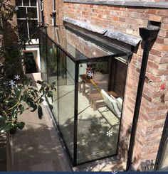 a brick building with a glass door on the outside