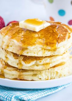 a stack of pancakes with butter and syrup on top