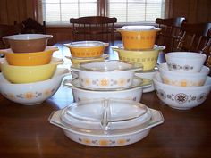 a table topped with lots of dishes and bowls