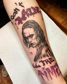 a person with a joker tattoo on their arm