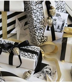 presents wrapped in black and white paper with gold ribbon