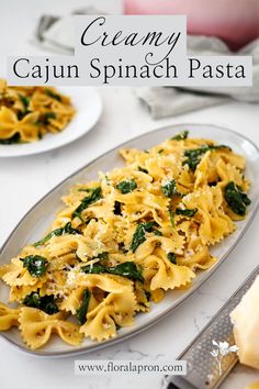 A plate of bowtie pasta with wilted spinach, topped with grated Parmesan cheese. Crusted Tilapia, Parmesan Pasta, Bowtie Pasta, Spinach Pasta, Creamed Spinach, Cheese Pasta, Cajun Seasoning, Tortilla Chips, Weeknight Dinner