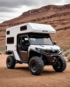 an off road vehicle parked in the desert