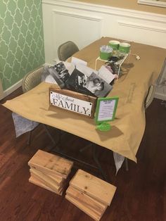 a table that has some pictures on top of it and is set up for a family celebration