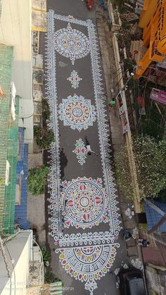 an aerial view of a street that has been decorated with intricate designs