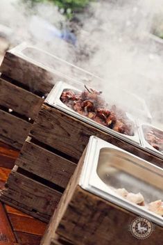 the food is being prepared on wooden pallets and placed in front of each other