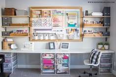 an organized craft room with lots of storage