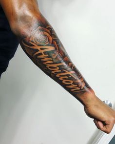 a man with a tattoo on his arm