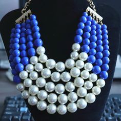 This Chunky Imitation Pearl Statement Necklace features a captivating combination of lustrous blue beads and delicate white imitation pearls, meticulously arranged to create a stunning contrast and visual appeal. The chunky design adds a touch of drama and boldness to any outfit, making it the perfect accessory to elevate your look for any occasion. Type: Chokers Necklaces Style: TRENDY Pearl Type: Simulated-pearl Shape\pattern: Geometric *Note Delivery Time: Due to the current global crisis (CO Blue Pearl Beaded Necklace For Party, Blue Pearl Chain Necklace, Blue Pearl Necklace With Pearl Chain, Blue Pearl Jewelry For Party, Party Pearl Jewelry In Blue, Blue Pearl Necklace With Round Beads, Blue Pearl Necklace For Party, Blue Beaded Pearl Necklace, Necklaces Style