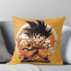 a dragon ball throw pillow on a couch with the image of gohan in yellow and black