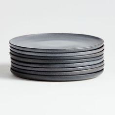 stack of black plates on white background