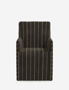 a black and white striped chair against a gray background with gold lines on the armrests