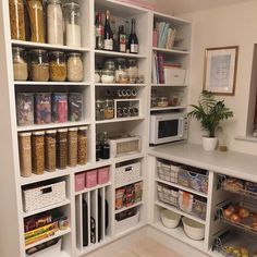 an organized pantry with lots of food in it