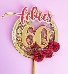 a cake topper that says, felicis 60 with roses on the side