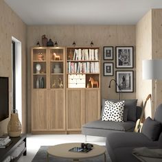 a living room filled with furniture and pictures on the wall above it's bookshelf