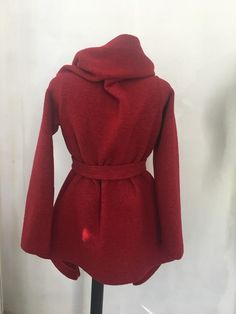 This is a new wool wrap cardigan.Looking fabulous either with the belt,wish is from the same material or without it.It will best fit for size S/M The colour is black .It is 100%wool and is really warm,would recommend dry cleaning for washing it.It does not have lining,it is like a big cosy shawl with sleeves.Has two discret buttons.An outstanding piese of clothing for the upcoming season.SIZE CHARTSIZE S - US 6, UK 8, EU 36bust: bust around 34.5”/90cmWaist: waist around 27.5”/70cmHips: hips arou Wool Wrap Outerwear For Fall, Wool Coat With Self Belt, Wool Coat With Self Belt And Long Sleeves, Long-sleeve Wool Coat With Self Belt, Fitted Wrap Winter Outerwear, Fitted Wrap Outerwear For Winter, Oversized Wrap Outerwear For Winter, Cozy Red Wool Outerwear, Shawl With Sleeves