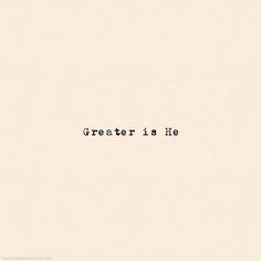 a black and white photo with the words greater is he written in cursive font