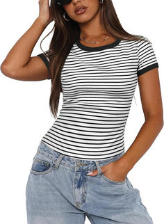 a woman wearing a black and white striped t - shirt with her hands on her head