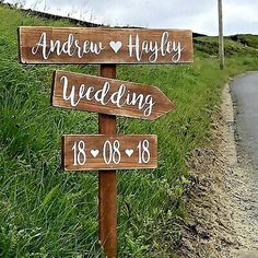 a wooden sign on the side of a road that says, and now happily wedding