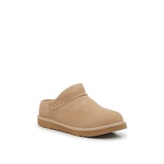 UGG-Classic Bootie Slipper - Kids' Make sure your kiddo's casual days are oh-so-cozy with the Classic bootie slippers from Ugg. Crafted with a suede material and a soft faux fur lining, this pair is designed to keep them warm throughout the seasons. Complete with a closure-free design they can easily add to their looks and a solid sole so they enjoy traction and durability. Not sure which size to order? Click here to check out our Kids’ Measuring Guide! For more helpful tips and sizing FAQs, click here . Ugg Slipper, Bootie Slippers, Ugg Slippers, Ugg Classic, Suede Material, The Seasons, Helpful Tips, Our Kids, Bootie