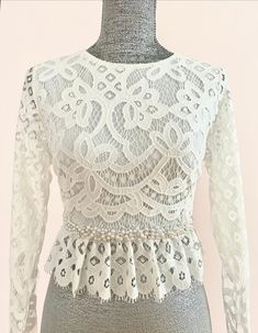 This beautiful lace top can be custom made just for you. Please send me a message to discuss this further.  Designed and Handmade in the USA by TLCoutureatelier Copyright © 2023 L&T Couture. All rights reserved. Elegant Fitted Wedding Dress With Delicate Lace, Elegant Wedding Dress With Delicate Lace, Elegant Cream Wedding Dress For Reception, White Delicate Lace Top For Party, Fitted Lace Wedding Dress With Lace Bodice, Elegant Long Sleeve Wedding Dress With Lace Bodice, Elegant Fitted Wedding Dress With Lace Back, Fitted Lace Wedding Dress For Ceremony, Elegant Lace Trim Wedding Dress For Party