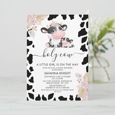 a black and white cow baby shower card