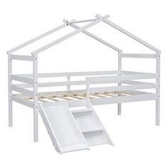 a white bunk bed with a slide in front of it and an open door on the bottom