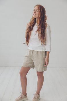 "DETAILS * Loose fit linen shorts with two side pockets * Average length above knees * Feel comfortable with elastic band around and wee belt to tie it up * Feel relax and doesn't limit your movements * Soft linen shorts is perfect for stylish summer outfit * Made from soft wash medium weight (185 gsm) 100 % European linen fabric * Height of the model is 165 cm (5′ 5″) and she is wearing shorts in size XS/S and flax linen fabric * The full length of linen shorts is +/- 46 cm/ 18.1\", inner seam Bermuda Linen Shorts With Elastic Waistband, Linen Bermuda Shorts With Elastic Waistband, White Linen Bermuda Knee-length Shorts, Linen Knee-length Shorts With Built-in Shorts, High-waisted Linen Shorts For Loungewear, Linen Bermuda Shorts With Built-in Shorts And Relaxed Fit, Linen Beachwear Bottoms With Built-in Shorts, Solid Linen Shorts With Built-in Shorts, Linen Cardigan