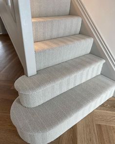 the stairs are made from white fabric and have herringbones on each treading