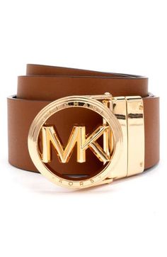 Logo detailing gives an iconic side to this reversible leather belt. Leather Imported Brown Leather Belt With Logo Plaque, Brown Leather Belt Buckle With Logo Plaque, Brown Leather Belt Buckles With Logo Plaque, Gold Leather Belt Buckle With Logo Plaque, Modern Leather Belt Buckles With Gold-tone Logo, Brown Leather Belt With Gold-tone Logo Plaque, Leather Belt With Gold-tone Logo For Business, Classic Brown Belt With Logo Plaque, Modern Brown Belt With Logo Plaque