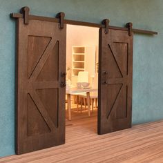 an open door leading to a dining room with a table and chairs in the background