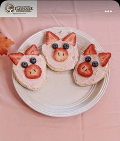 three little pigs made out of fruit on top of a white plate with pink table cloth