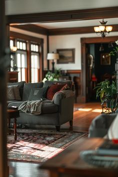 a living room filled with furniture and lots of windows