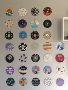 the wall is covered with many different types of plates and magnets on it's side