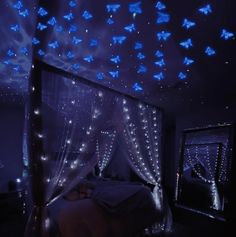 a bed with blue lights on the ceiling