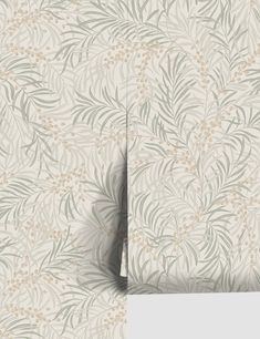 an image of a wallpaper with leaves and flowers on the back, in shades of green