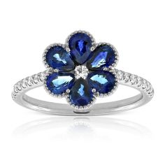 Sapphire petals grow out from a diamond center to form the shape of a flower. Milgrain detailed edges and diamonds set on the band, add even more sparkle to this timeless nod to nature design. Diamond Flower, Ring Fit, Perfect Engagement Ring, Flower Ring, Ring Size Guide, Sapphire Diamond, White Ring, Cleaning Jewelry, White Gold Rings