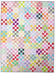 a multicolored quilt with squares on it