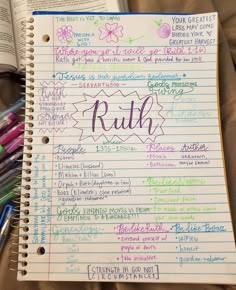 an open notebook with writing on it next to pens and paper sheets that read ruth