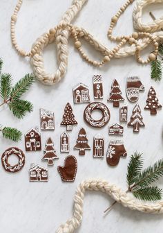 christmas cookies and decorations are laid out on a table